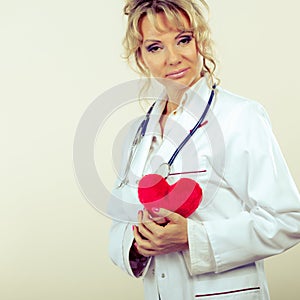 Female cardiologist with red heart.