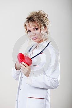 Female cardiologist with red heart.