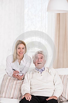 Female caregiver and senior man