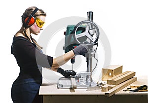 Female carpenter and drilling machine.