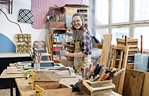 Female carpenter working in her workshop