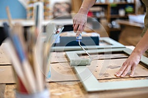 Female carpenter working in her workshop