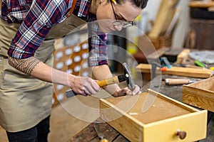 Female carpenter working in her workshop