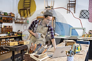 Female carpenter working in her workshop