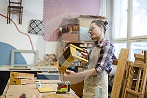 Female carpenter working in her workshop