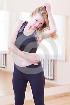 Female Caucasian Athlete In Good Fit Having Body Stretching Exercise