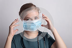 Female caucasian doctor nurse woman  wearing surgical mask