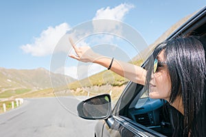 Female caucasian woman from car window