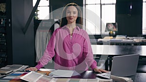Female Caucasian woman happy joyful girl businesswoman manager fashion designer tailor couturier cheerful smiling at