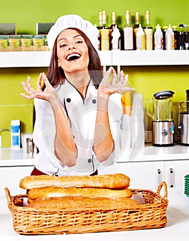 Female chef holding food.