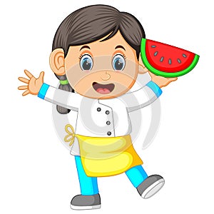 A female chef holding watermelon