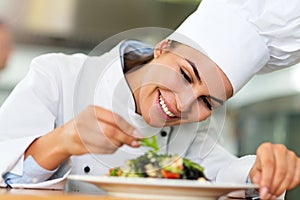 Female chef in kitchen photo