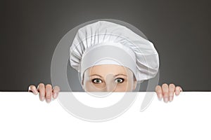 Female chef looking over billboard