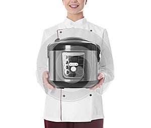 Female chef with modern multi cooker on white background