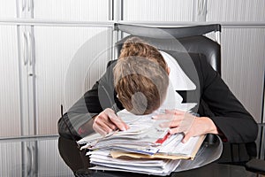 Female chef in the office with too much work