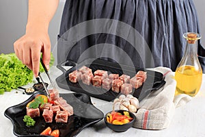 Female Chef Preparing Premium Wagyu Diced Beef or Saikoro, Marble Meat Cut into Cubed for Grill