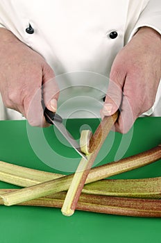 Female chef preparing some rhubarb