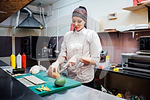 Female chef preparing a sushi restaurant in the kitchen