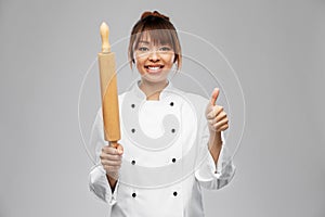 female chef with rolling pin showing thumbs up