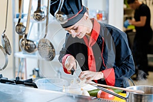 Chef cutting cauliflower