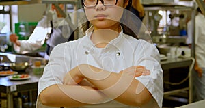 Female chef smiling in kitchen at restaurant 4k