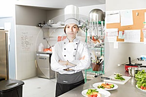 Beautiful Cook Standing In Commercial Kitchen