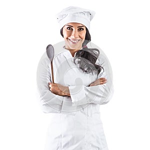 Female chef standing with a wooden scoop and crossed arms - Isolated on white