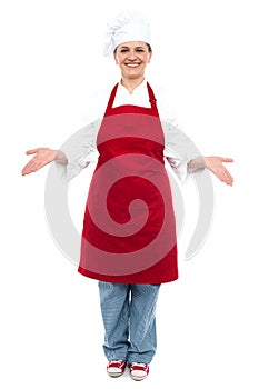 Female chef welcoming you with a smile