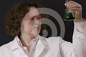 Female chemist with a solution