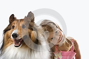 Female child with Collie dog.