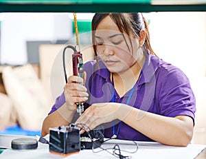 Female chinese worker in factory