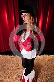 Female circus artist announcing the show photo