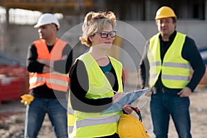 Female civil engineer at work on construction site