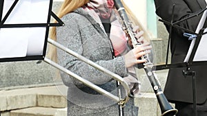 Female clarinet player in a street band