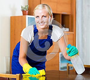 Female cleaner doing regular clean-up