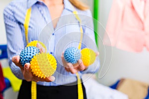 Female cleaner in laundry shop