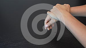 Female is cleaning and disinfecting hands using hand sanitizer. Woman hands are using antiseptic antibacterial hand sanitizer to p