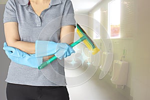 Female cleaning staff in bathroom blurry background