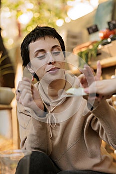 Female client tastes fresh organic apple