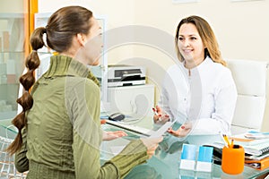Female client visiting in aesthetic medicine center