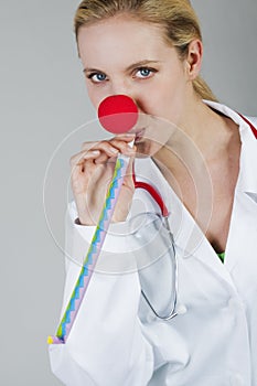 Female clown doctor with red nose