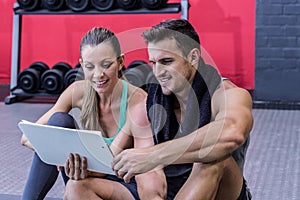 A female coach explaining directives with clipboard photo