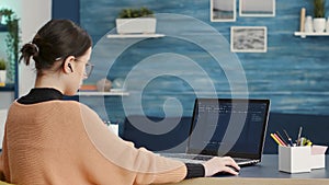 Female coder programming analytics report on technical interface