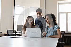 Female colleagues, discuss new project, develop business strategy using laptop