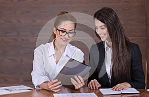 Female colleagues sharing ideas about work