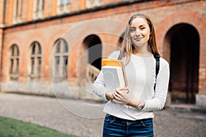 Female college student. Happy girl in european university for scholarship.