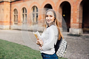 Female college student. Happy girl in european university for scholarship.