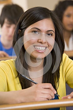 Female college student listening to a lecture