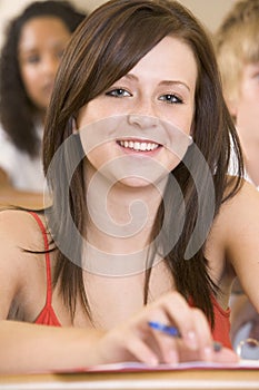 Female college student listening to a lecture