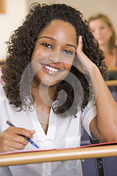 Female college student listening to a lecture